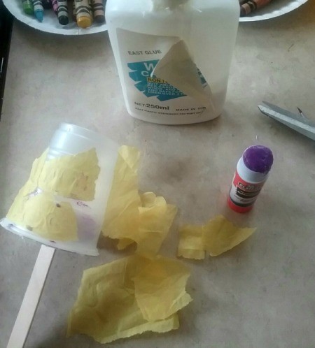 Handmade Maracas for Children - glue torn paper to the outside of the cup