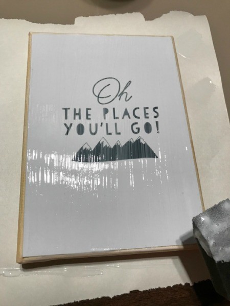 How to Mod Podge Cardstock to Canvas - using sponge brush apply a coat of mod podge to print