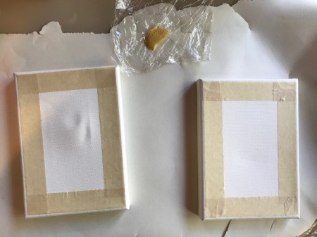 How to Mod Podge Cardstock to Canvas - add masking tape to create a frame to the width you desire