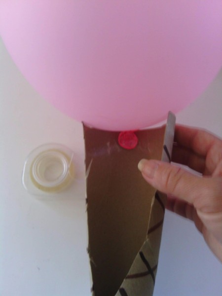 Balloon Ice Cream Cone Decoration - blow up a balloon and tape it to the back inside of the cone