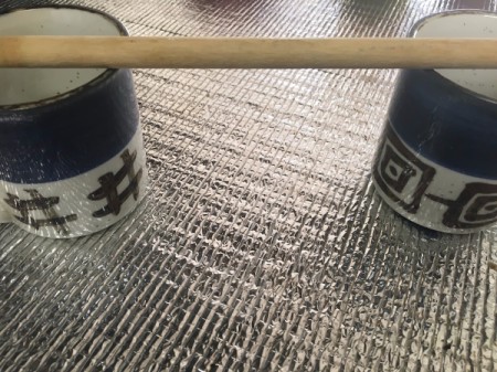 2 cups with wooden spoon across the top