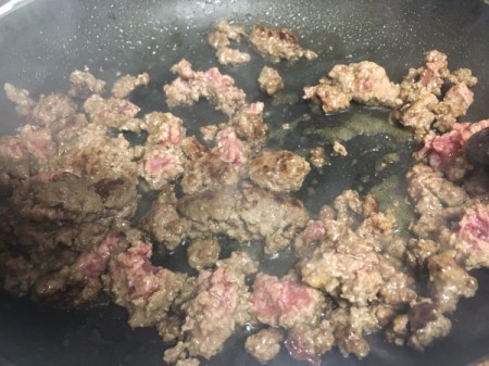 cooking burger in pan