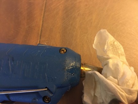 Contact Lens Case as Earbud Headphones Case - wipe off glue gun to remove melted plastic