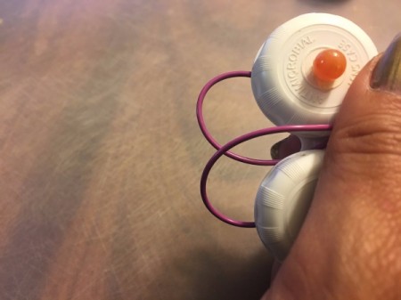 Contact Lens Case as Earbud Headphones Case - gently wrap wire between bowls