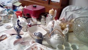 Items in a home prepared for an indoor yard sale.