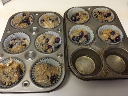 filled blueberry muffin tins ready to bake