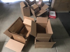 A pile of different sizes of cardboard boxes.
