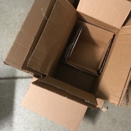 Cardboard boxes stacked inside one another.