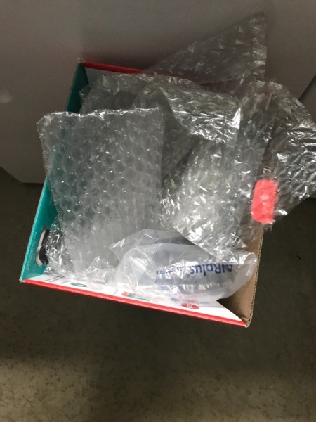 Packaging material stored inside a cardboard box.