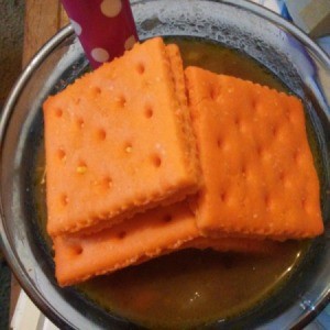 A bowl of Umbrian Lentil Soup with cheese crackers.