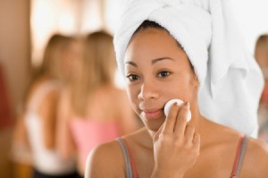 Girl applying Witch Hazel Toner to her face