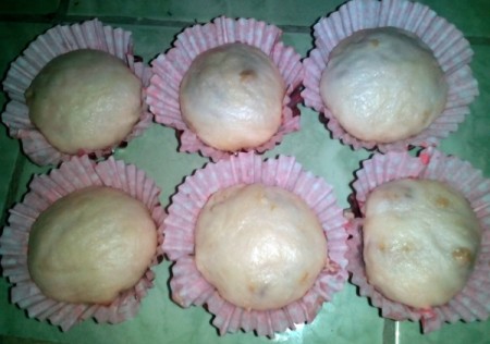 filled dough in cupcake papers