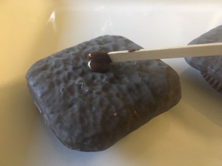 Graduation Cap Treats - add a dab of melted chocolate to center of graham cracker