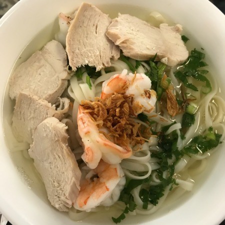 Korean-Style Noodle Soup with Chicken and Shrimp in bowl