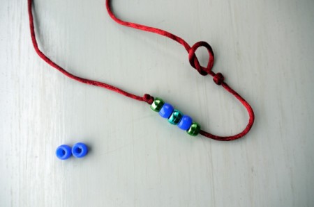Surfer Dude Wrist Band - Tie another knot near one of the first ones the other side of it to the beads. Do not pull tight.