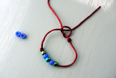 Surfer Dude Wrist Band - end of cord through loop