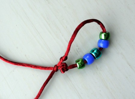 Surfer Dude Wrist Band - the cord will now slip through the knot to tighten or loosen