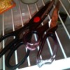 Two pairs of scissors stored inside a refrigerator.