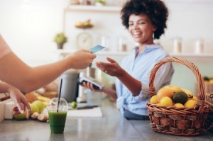 Woman using Credit Card at store