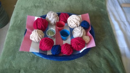 Crocheted Americana Centerpiece - make crochet chains with the yarn and wrap it around the balls, secure beginning and end with pins