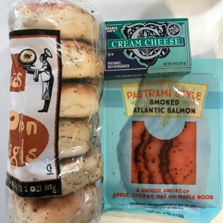 A package of bagels, cream cheese and smoked salmon.