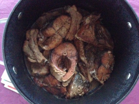 cooking ribs and fish chunks