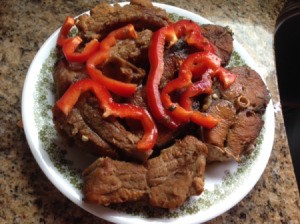 Caramelized Yellow Tail and Baby Back Ribs with red pepper slices