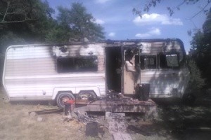 Help After the Red Cross Helps House Fire Victims - burned out motor home