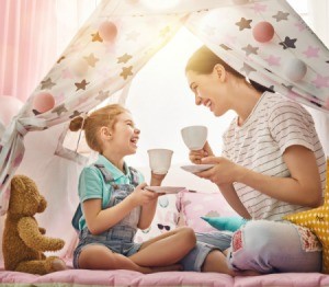 Mother and Daughter Having Tea Party