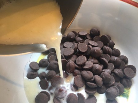 pouring hot mixture into chocolate chips