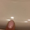 Tiny Biting Black Bugs  - finger pointing to tiny bug