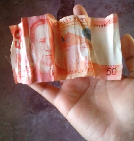 A wrinkled bill from the Philippines.
