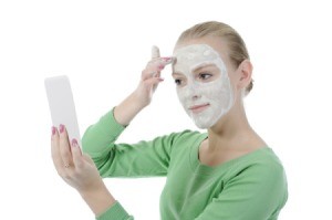 Woman Applying Aspirin Face Mask