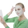 Woman Applying Aspirin Face Mask