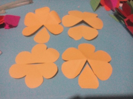 Layered Paper Flowers - cut one petal out of 2 flowers, 2 out of the third and cut the fourth in half