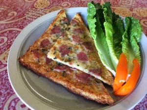 Flourless Chicken Pizza Crust pieces on plate