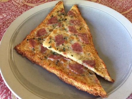 Flourless Chicken Pizza Crust pieces on plate