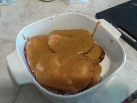 Ham with Sweet Mustard Sauce in casserole ready to bake