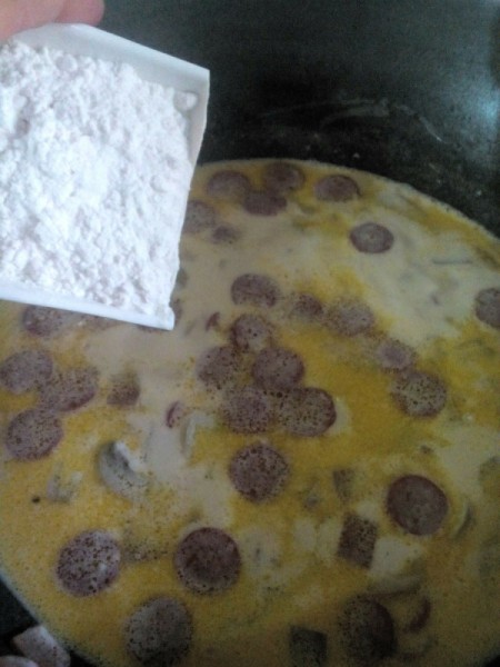 adding flour to pan