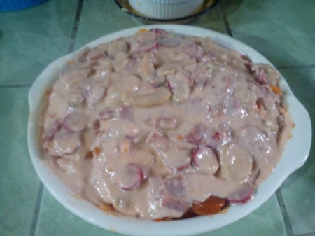 spaghetti covered with mushroom sauce in casserole dish