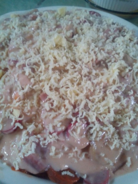 filled casserole dish covered with cheese