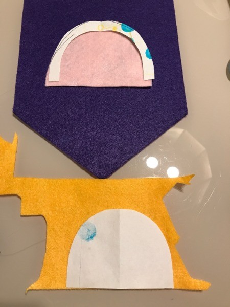 Pennant Flag Wall Decor - remove a piece from pattern after cutting each layer of the rainbow, pattern on yellow felt