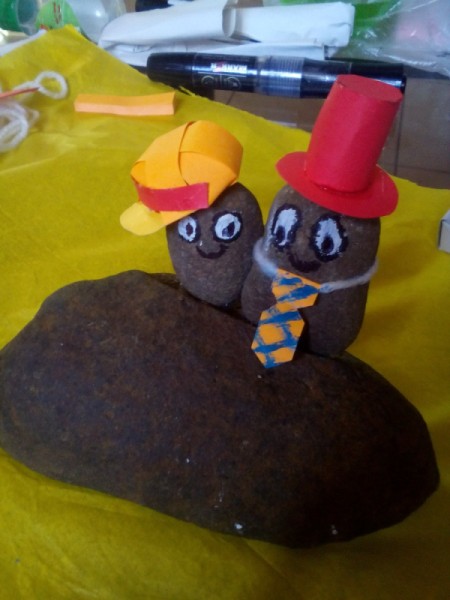 Father's Day Rock Art - hot glue the father and son onto the larger rock