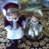 Value of Seymour Mann Dolls - girl and boy doll sitting on a bench