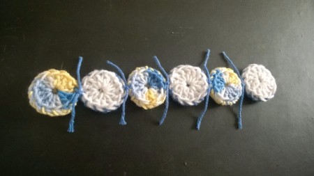 Crocheted Yo Yo Place Mat - tying individual yo yos together