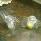 Homemade Small Toiletry Containers - two spice containers in plastic bags to protect against spills