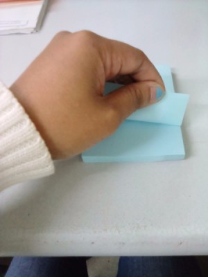 A sticky note being pulled from left to right.