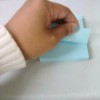 A sticky note being pulled from left to right.