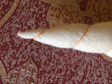 DIY Unicorn Headband - beginning at point stitch on some gold thread and start wrapping down to larger end