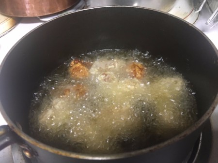 frying batch of chicken pieces